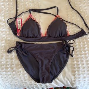 Purple triangle top bikini. Size medium. Never worn.